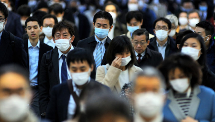 TOKYO, JAPAN - APRIL 2 : People wearing face masks are seen duri
